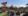 people sitting on picnic rugs