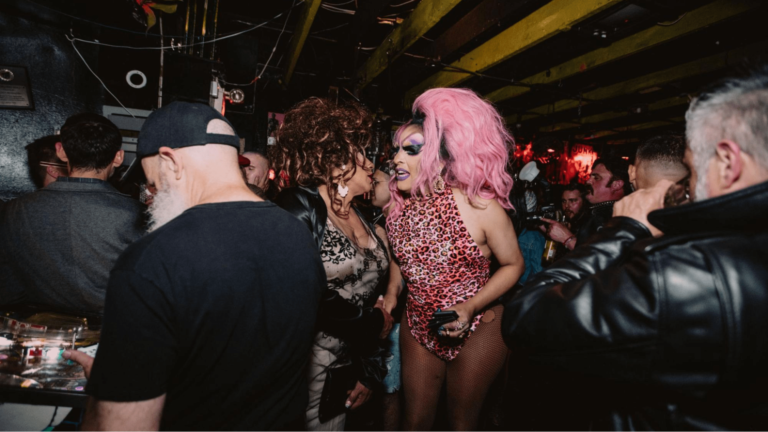 Dancers talking in crowded nightclub