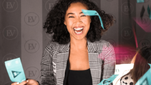 Woman holding gifts from event organizer