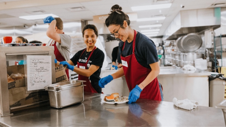 Charity event staff prepare meals