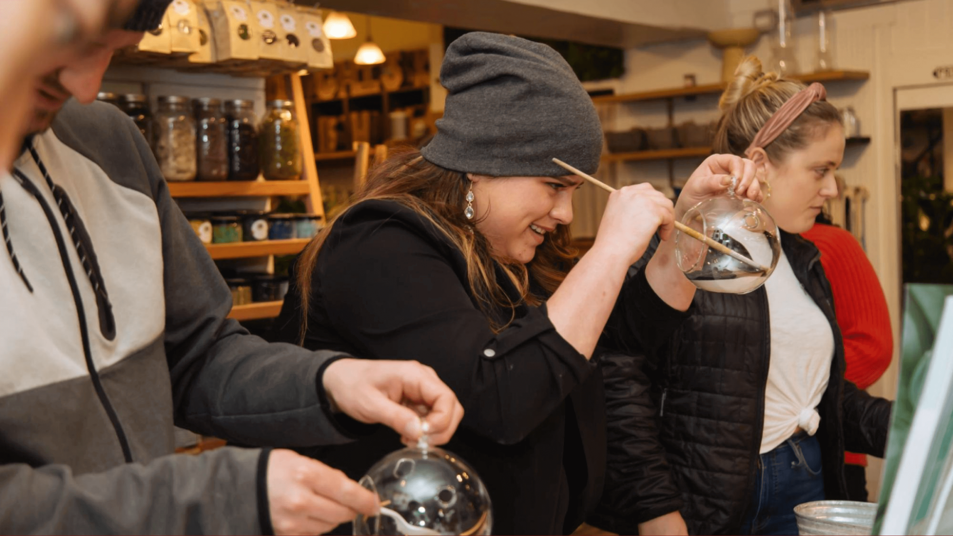 Workshop attendees paint glass bowls