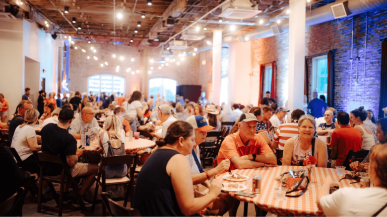 Crowd eating at tables