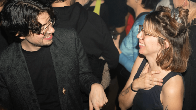 A couple talking at nightclub