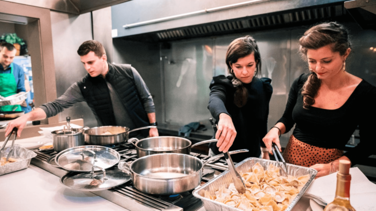 Event staff prepare a meal in the kichen of an event venue